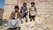 Children sit on a wall in Yemen Children sit on a wall in Yemen