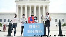 Deferred Action for Childhood Arrivals (DACA) demonstrators stand outside the US Supreme Court in Washington, DC, on June 15, 2020. (Photo by JIM WATSON / AFP) (Photo by JIM WATSON/AFP via Getty Images)