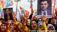 Supporters of the pro-Kurdish Peoples' Democratic Party (HDP) hold a picture of jailed former party leader Selahattin Demirtas as they attend a 'Peace and Justice' rally in Istanbul on February 3, 2019. - Thousands of protesters on February 3 joined a rally in Istanbul called by a pro-Kurdish party to show support for hunger strikes against prison conditions of Kurdish militant leader Abdullah Ocalan. (Photo by Yasin AKGUL / AFP) (Photo credit should read YASIN AKGUL/AFP via Getty Images)