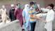 Health workers checks people's body temperature in Lahore city Health workers checks people's body temperature in Lahore city