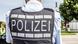 Polizist mit Handschellen Polizist mit Handschellen