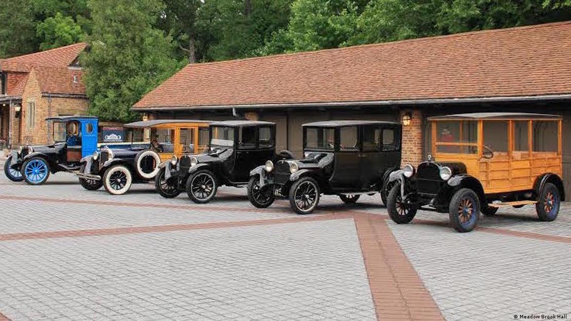 An array of Dodge Brothers vehicles to mark the company's 100th anniversary in 2014. From left: A 1919 Graham Brothers truck (built with a Dodge chassis), a 1927 Dodge depot hack, a 1947 Dodge truck, a 1915 Dodge touring car and a 1925 Dodge depot hack - Meadow Brook Hall