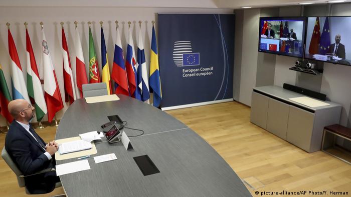 uropean Council President Charles Michel, left, speaks with Chinese Premier Li Keqiang, on screen, during an EU-China summit, in video conference format, at the European Council in Brussels