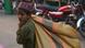 A Pakistani young laborer busy in their workplace at an iron market in Lahore. A Pakistani young laborer busy in their workplace at an iron market in Lahore.