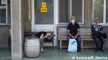 People suspected to be infected with coronavirus disease (COVID-19) wait in front of the Hospital for Infectious and Tropical Diseases of the Clinical Center of Serbia in Belgrade, Serbia June 26, 2020. REUTERS/Marko Djurica