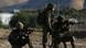 Israeli soldiers aiming their weapons at Palestinian protesters in Jordan Valley Israeli soldiers aiming their weapons at Palestinian protesters in Jordan Valley