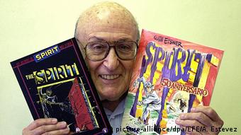 cartoonist Will Eisner with copies of his comics 'The Spirit'