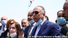 A handout picture released by Iraq's Prime Minister's Media Office on June 10, 2020, shows Prime Minister Mustafa Kadhimi (3-R) arriving in the northern city of Mosul, for a visit on the occasion of the 5th anniversary of the capture of the city by the Islamic State (IS) group. - Iraqi forces announced the liberation of the country's second city Mosul on July 10, 2017, after a bloody nine-month offencive to end the Islamic State (IS) group's three-year rule there. (Photo by - / various sources / AFP) / === RESTRICTED TO EDITORIAL USE - MANDATORY CREDIT AFP PHOTO / HO / IRAQI PRIME MINISTER'S PRESS OFFICE - NO MARKETING NO ADVERTISING CAMPAIGNS - DISTRIBUTED AS A SERVICE TO CLIENTS ===