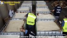 01.07.2020
This image taken from a video shows customs police officers inspecting boxes full of amphetamines pills that were seized at the Salerno harbor, southern Italy, Wednesday, July 1, 2020. Italian police have seized 14 tons of amphetamines, allegedly produced in Syria by Islamic State group to fund terrorist activities and destined for the European illegal drug market. Customs Police Col. Domenico Napolitano on Wednesday called the discovery of three shipping containers crammed with some 85 million pills, in the southern port of Salerno, the biggest amphetamine seizure ever made worldwide. (Guardia di Finanza via AP) |