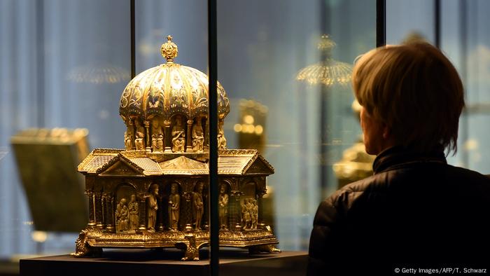 A visitor looks at the the cupola reliquary (Kuppelreliquar) of the so-called Welfenschatz (Guelph Treasure) displayed at the Kunstgewerbemuseum (Museum of Decorative Arts) in Berlin