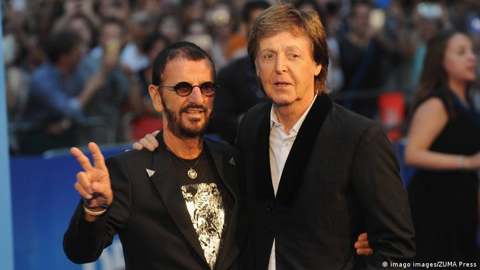 Paul McCartney and Ringo Starr pose for the camera.