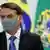 Президент Бразилии Жаир Болсонару в защитной маске