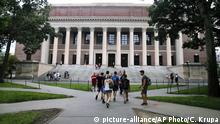 FILE - In this Aug. 13, 2019 file photo, students walk near the Widener Library in Harvard Yard at Harvard University in Cambridge, Mass. The Ivy League school announced Monday, July 6, 2020, that as the coronavirus pandemic continues its freshman class will be invited to live on campus this fall, while most other undergraduates will be required learn remotely from home. (AP Photo/Charles Krupa, File) |