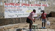 Two young girls sell groundnuts in front of an informational mural advising on precautions to avoid catching the new coronavirus, in the Kibera slum, or informal settlement, of Nairobi, Kenya Thursday, April 2, 2020. Writing on wall in Swahili reads To prevent the spread of coronavirus avoid congested places, stay at home, don't touch your nose, cover your mouth while coughing, wash your hands, call emergency toll free line when you suspect the symptoms. (AP Photo/Brian Inganga) |