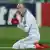 Arjen Robben kneeling on the pitch