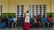 Voters waiting in queue in Ivory Coast as an election official looks on. Voters waiting in queue in Ivory Coast as an election official looks on.