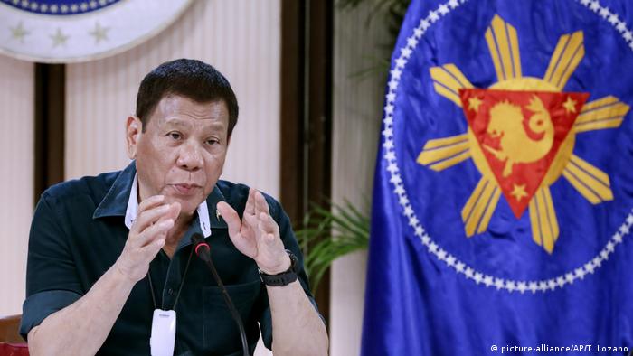 Philippine President Rodrigo Duterte gestures as he talks to cabinet officials during a meeting at the Malacanang presidential palace in Manila