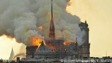 In this image made available on Tuesday April 16, 2019 flames and smoke rise from the blaze at Notre Dame cathedral in Paris, Monday, April 15, 2019. An inferno that raged through Notre Dame Cathedral for more than 12 hours destroyed its spire and its roof but spared its twin medieval bell towers, and a frantic rescue effort saved the monument's most precious treasures, including the Crown of Thorns purportedly worn by Jesus, officials said Tuesday. (AP Photo/Thierry Mallet) |