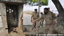 Policemen inspect the scene of an ambush in Kanpur, India, Friday, July 3, 2020. A gang of criminals ambushed and fired on police who had come to arrest them in a northern Indian village early Friday, killing eight of the officers, a government official said. The criminals blocked a road with excavators and fired on the police officers from rooftops, said Awanish Awasthi, an Uttar Pradesh state government spokesman. Five officers were injured and the assailants fled before police reinforcements could reach the area, Awasthi said. (AP Photo) |