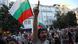 A man shouts and points his finger in front of a Bulgarian flag during demonstrations A man shouts and points his finger in front of a Bulgarian flag during demonstrations