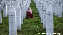 10.07.2020
SREBRENICA, BOSNIA AND HERCEGOVINA - JULY 10: A Bosnian Muslim woman cries between graves of her father, two grandfathers and other close relatives, all victims of Srebrenica genocide, July 10, 2020, at the cemetery in Potocari near Srebrenica, Bosnia and Hercegovina. More than 8,000 Bosnian Muslim men and boys were killed after the Bosnian Serb Army attacked Srebrenica, a designated UN safe area, on 10-11 July 1995, despite the presence of UN peacekeepers. There have been high-level prosecutions of some principal architects of the war in Bosnia and Herzegovina, including Ratko Mladic and Radovan Karadzic, yet there is still a backlog of cases pending before courts in the country. (Photo by Damir Sagolj/Getty Images)