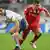 Munich's Ivica Olic, right, and Manchester's Rio Ferdinand challenge for the ball