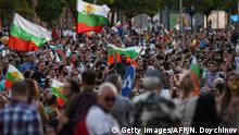 Protestors shout slogans and wave Bulgarian national flags during an anti-government protest in Sofia, on July 11, 2020. - The Bulgarian President called on July 11, 2020 for the resignation of the government and the chief prosecutor after clashes between demonstrators and police left at least five injured and lead to around twenty arrests. (Photo by NIKOLAY DOYCHINOV / AFP) (Photo by NIKOLAY DOYCHINOV/AFP via Getty Images)