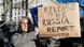 A protester outside Downing Street holding up a sign urging the release of the Russia report A protester outside Downing Street holding up a sign urging the release of the Russia report