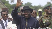 FILE- In this Monday, Feb. 27, 2012 file photo, Former Nigeria's President Goodluck Jonathan, waves to the crowd as he visits Koluama 2 village, in the Niger delta Nigeria. A splinter group of Nigerian oil militants accuses former President Goodluck Jonathan and other politicians in the oil-rich Niger Delta of sponsoring attacks on oil installations that have slashed the West African nation's petroleum production.
(AP Photo/Sunday Alamba, File) |