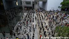 BEIJING, CHINA - JULY 17: People wait in line following social distancing rules before the official opening of the new Apple Store in the Sanlitun shopping area on July 17, 2020 in Beijing, China. The new store replaces Apple's first ever China store which opened in 2008 prior to the Beijing Olympics adjacent to the new location. Chinas economy returned to growth in the second quarter of 2020, after historic declines in the first quarter due to the coronavirus pandemic. According to figures released by the government Thursday, the gross domestic product grew 3.2% in the quarter from a year ago, reversing a 6.8% contraction in the first part of the year as the country battled the outbreak.
(Photo by Kevin Frayer/Getty Images)