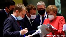 Spain's Prime Minister Pedro Sanchez, France's President Emmanuel Macron and German Chancellor Angela Merkel look into documents during the first face-to-face EU summit since the coronavirus disease (COVID-19) outbreak, in Brussels, Belgium July 20, 2020. John Thys/Pool via REUTERS