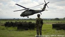 An UH-60 Black Hawk army helicopter takes off from a military base in Miranda, Cauca department, Colombia, on January 18, 2012. The Colombian army created the Apolo joint task force with area of influence located in the southwestern department of Cauca.TF Apolo is responsible for fighting the Revolutionary Armed Forces of Colombia (FARC) guerrillas and the drugs and arms traffickers in that specific territory. AFP PHOTO / Luis ROBAYO (Photo credit should read LUIS ROBAYO/AFP via Getty Images)