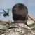 German soldiers salute a departing helicopter in Kunduz