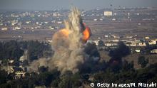 QUNEITRA, SYRIA - JULY 22: (ISRAEL OUT) An explosion in Quneitra on the Syrian side of the Israeli-Syrian border is seen from the Israeli Golan Heights on July 22, 2018 in Quneitra, Syria. A Russian-brokered deal between rebels and the Syrian Government allows the rebels and any civilians choosing to leave Queneitra to travel to opposition-held Idlib in the North of Syria. (Photo by Lior Mizrahi/Getty Images)