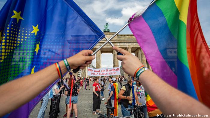 Demonstrators hold EU and Rainbow Flags during July's Dyke March in Berlin