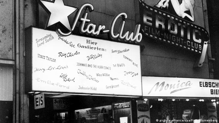 Hamburg Star-Club 1, building with marquee with nases of bands and neon sign that reads Star Club