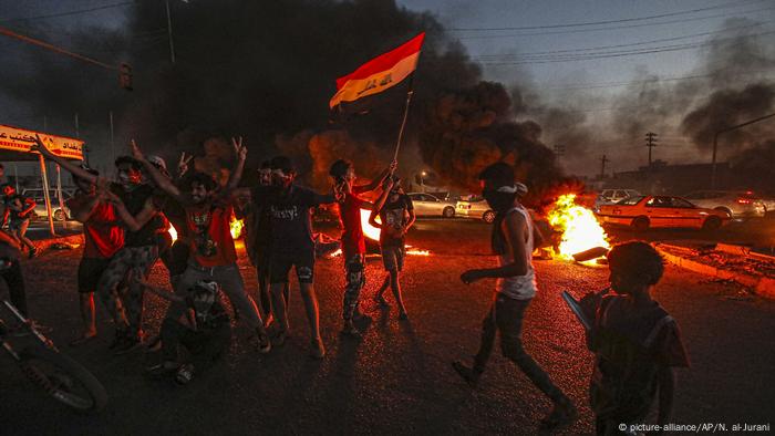 Protesters burn tire in Basra, southern Iraq, in the summer of 2020. 