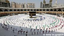 29.07.2020 *** A picture taken on July 29, 2020 shows pilgrims circumambulating around the Kaaba, Islam's holiest shrine, at the centre of the Grand Mosque in the holy city of Mecca, ahead of the annual Muslim Hajj pilgrimage. - Mask-clad Muslim pilgrims began the annual hajj, dramatically downsized this year as the Saudi hosts strive to prevent a coronavirus outbreak during the five-day pilgrimage. The hajj, one of the five pillars of Islam and a must for able-bodied Muslims at least once in their lifetime, is usually one of the world's largest religious gatherings. (Photo by STR / AFP) (Photo by STR/AFP via Getty Images)