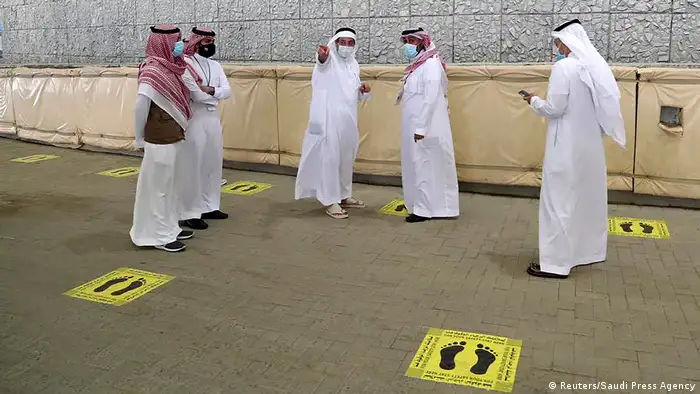 Saudi officials are seen where Muslim pilgrims head to cast stones at pillars symbolizing Satan