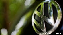 FILE PHOTO: A logo of German carmaker Volkswagen is seen on a car parked on a street in Paris, France, July 9, 2020. REUTERS/Christian Hartmann/File Photo