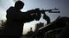 An Afghan soldier fighting a gun An Afghan soldier fighting a gun