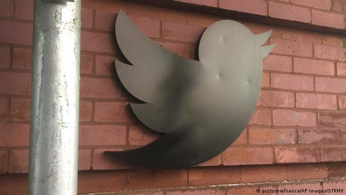 Twitter's logo on a brick wall