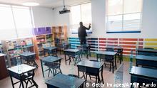 Picture of desks with acrylic shields put as a preventive measure against the spread of the novel coronavirus, COVID-19, at a Motolinia school classroom in Mexico City, on July 15, 2020, ahead of the reopening of educational facilities. (Photo by Pedro PARDO / AFP) (Photo by PEDRO PARDO/AFP via Getty Images)