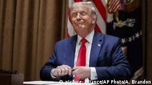 President Donald Trump prepares to sign an Executive Order on hiring American workers, in the Cabinet Room of the White House, Monday, Aug. 3, 2020, in Washington.(AP Photo/Alex Brandon) |
