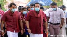 Leader of Sri Lanka People's Front party and Prime Minister Mahinda Rajapaksa wearing a protective mask arrives to cast his vote at a polling station during the country's parliamentary election, following the coronavirus disease (COVID-19) outbreak, in Medamulana, Sri Lanka, August 5, 2020. REUTERS/Stringer