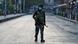 An Indian police officer patrols on a street in Srinagar during a lockdown on the first anniversary of the revocation of Kashmir's autonomy An Indian police officer patrols on a street in Srinagar during a lockdown on the first anniversary of the revocation of Kashmir's autonomy