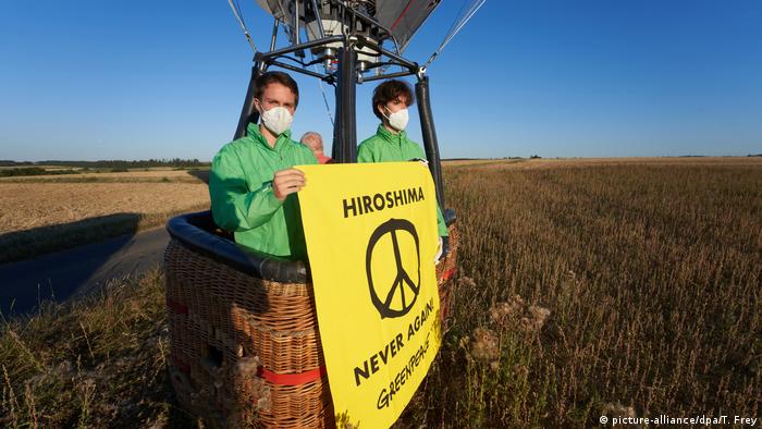 Greenpeace demonstrators in Germany hold a sign from a hot air balloon protesting the use of nuclear weapons.