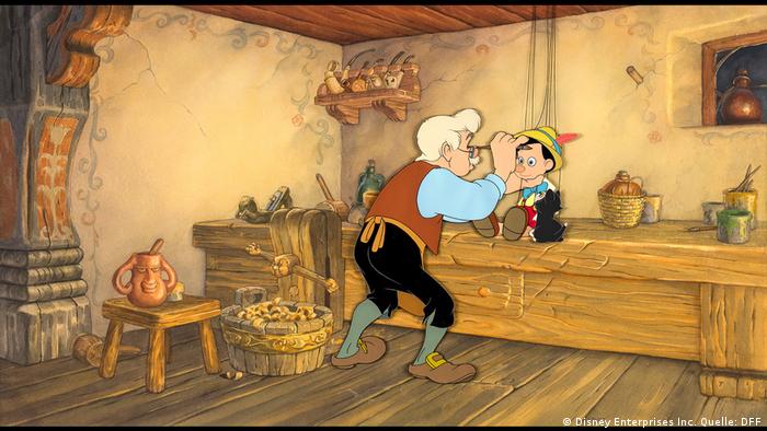 Szene aus dem Disney-Film Pinocchio in Holzwerkstatt mit den beiden Hauptfiguren, dem Tischler und dem Titelhelden Bild: Deutsches Filminstitut & Filmmuseum (Disney Enterprises Inc. Quelle: DFF)