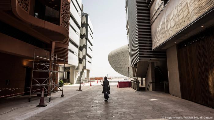 A student walking through the narrow streets on the Masdar Institute of Science and Technology campus A student walking through the narrow streets on the Masdar Institute of Science and Technology campus
