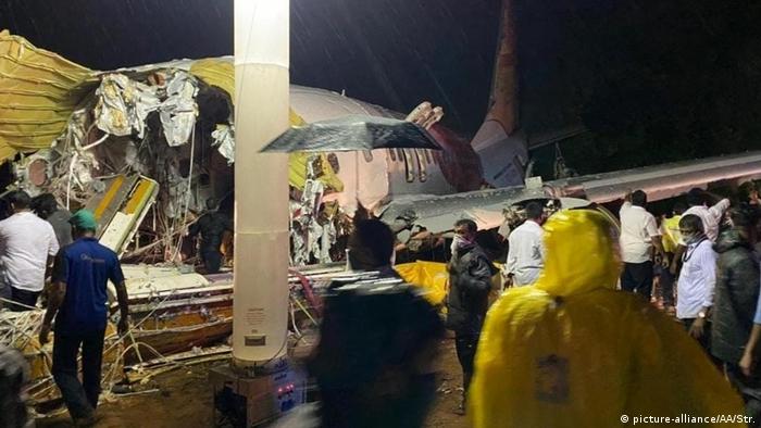The back half of a passenger plane after it crashed and broke into two pieces at Calicut airport in Kerala, India